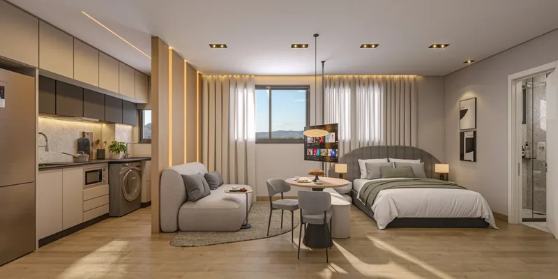 Studio decorado com cozinha, sala e quarto no mesmo ambiente